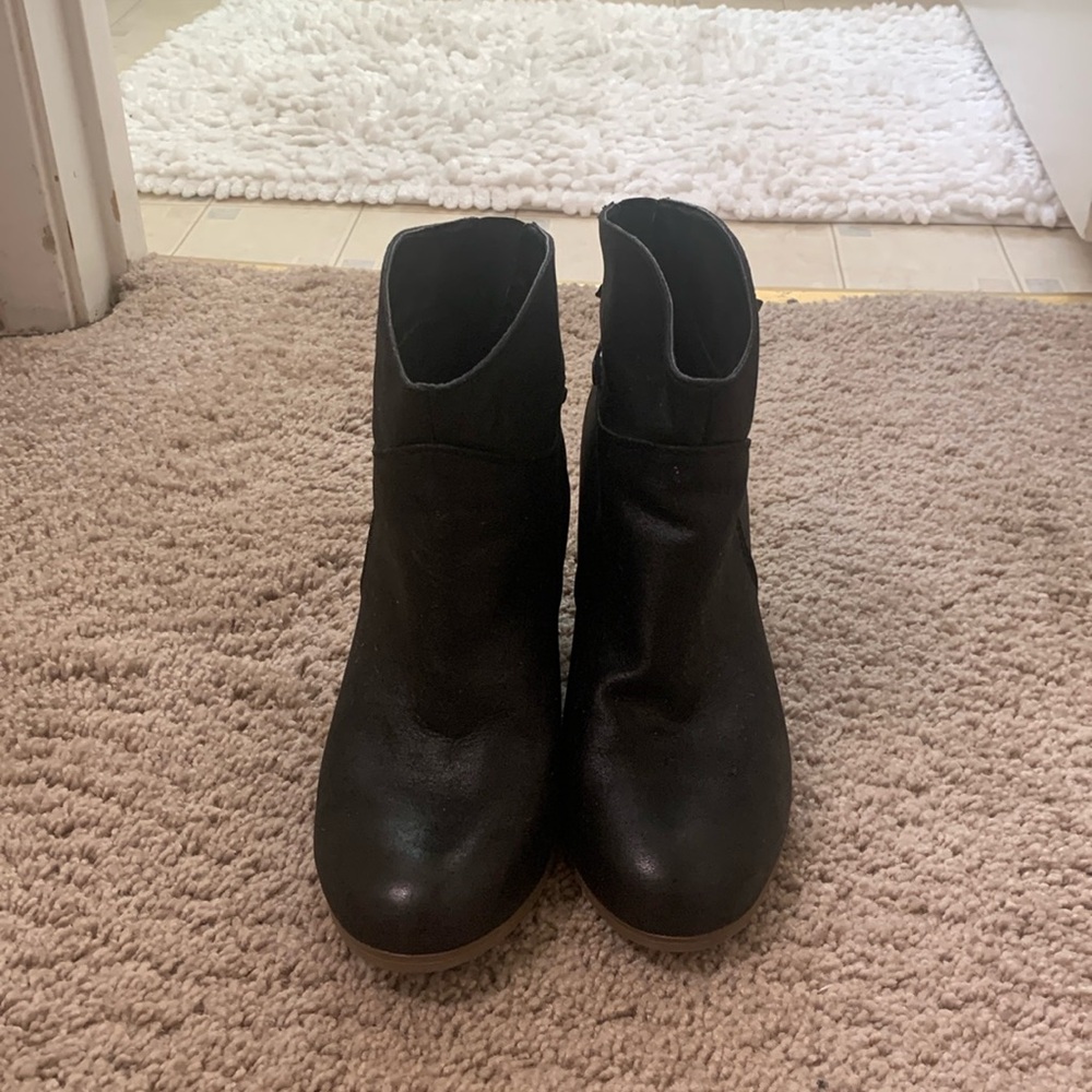 Gently worn black boots with lace on the back